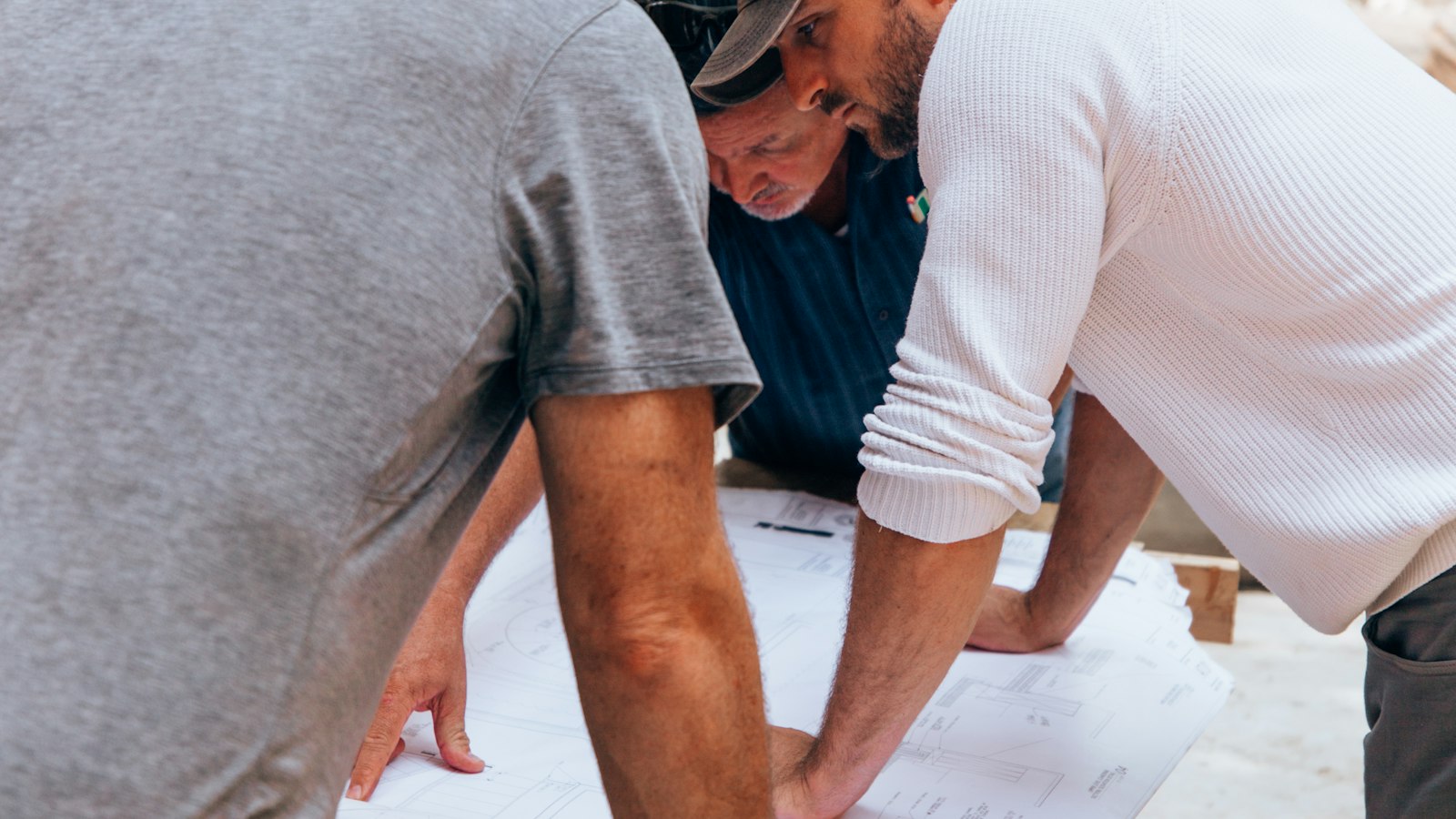 Reconstruction crew reviewing plans