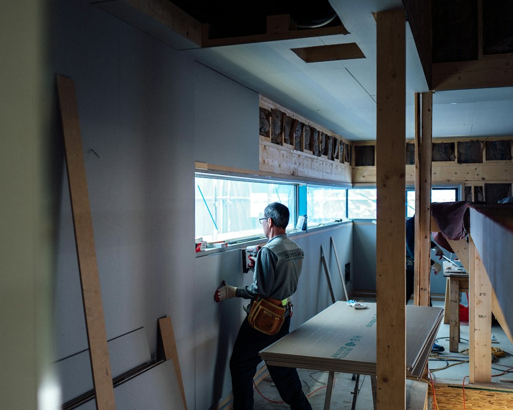 Contractor painting an interior wall